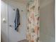 Clean bathroom with a tub and shower combination, featuring a charming coral-themed shower curtain at 6 Belleview Blvd # 505, Belleair, FL 33756
