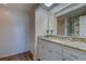 Bathroom featuring granite countertops, vanity with sink, and a view of the shower at 6 Belleview Blvd # 505, Belleair, FL 33756