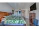 Bedroom with hardwood floors and tropical leaf patterned bedding at 6 Belleview Blvd # 505, Belleair, FL 33756