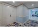 Elegant hallway with patterned floors and neutral decor leads to the main entrance of the unit at 6 Belleview Blvd # 505, Belleair, FL 33756