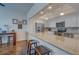 Modern condo kitchen featuring white cabinets, granite countertops, and stainless steel appliances at 6 Belleview Blvd # 505, Belleair, FL 33756
