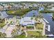 Aerial view of waterfront home with dock and nicely landscaped yard at 6241 Bayside Dr, New Port Richey, FL 34652