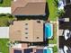 Overhead view of a neighborhood featuring a house with a private pool and a boat dock at 6241 Bayside Dr, New Port Richey, FL 34652