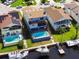 Waterfront home featuring a private swimming pool, dock, and boat lift, creating a perfect backyard oasis at 6241 Bayside Dr, New Port Richey, FL 34652