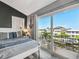Bedroom with balcony overlooking boat harbor and two full beds at 6241 Bayside Dr, New Port Richey, FL 34652