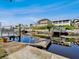 Waterfront dock featuring boat lifts, providing convenient access to waterways and stunning water views at 6241 Bayside Dr, New Port Richey, FL 34652