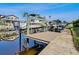 Waterfront dock with a boat lift, offering convenient access for boating enthusiasts and stunning water views at 6241 Bayside Dr, New Port Richey, FL 34652