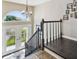 Elegant entryway with a staircase and natural light streaming through the door window at 6241 Bayside Dr, New Port Richey, FL 34652