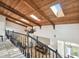 High-ceiling foyer with wood ceiling and skylights offering views of the spacious living area at 6241 Bayside Dr, New Port Richey, FL 34652