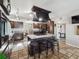 Open kitchen featuring a large center island with seating, tile floors, and modern appliances at 6241 Bayside Dr, New Port Richey, FL 34652