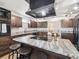 Beautiful kitchen with granite countertops, stainless steel appliances, and a large center island with seating at 6241 Bayside Dr, New Port Richey, FL 34652