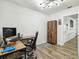 Home office boasts wood floors, modern lighting, and functional desk space at 6241 Bayside Dr, New Port Richey, FL 34652
