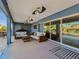 The covered patio has comfortable seating and ceiling fans, perfect for enjoying the outdoors at 6241 Bayside Dr, New Port Richey, FL 34652