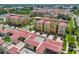 Aerial view of the property showing lush landscaping, multiple rooftop patios, and colorful townhomes at 6407 Mayra Shores Ln, Apollo Beach, FL 33572