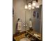 Updated bathroom with granite countertops, vanity mirror, and modern fixtures at 6407 Mayra Shores Ln, Apollo Beach, FL 33572