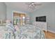 Sunlit bedroom features a balcony with pleasant outdoor views at 6407 Mayra Shores Ln, Apollo Beach, FL 33572