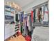 Organized walk-in closet with shelving, hanging rods, and storage for clothing and shoes at 6407 Mayra Shores Ln, Apollo Beach, FL 33572