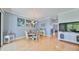 Light filled dining area adjacent to the kitchen with lovely artwork at 6407 Mayra Shores Ln, Apollo Beach, FL 33572