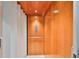 Interior of a private elevator with wood paneled walls and white trim at 6407 Mayra Shores Ln, Apollo Beach, FL 33572