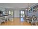 Spacious living area featuring a dining table, bar, and access to balconies with scenic views at 6407 Mayra Shores Ln, Apollo Beach, FL 33572