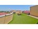 An outdoor rooftop patio with lush artificial turf, outdoor furniture, and ocean views at 6407 Mayra Shores Ln, Apollo Beach, FL 33572
