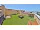 This property features a large rooftop patio with artificial grass, outdoor seating, and great views at 6407 Mayra Shores Ln, Apollo Beach, FL 33572