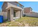 The backyard features a covered patio, partial fencing, and a grassy area at 7350 Lumber Port Dr, Ruskin, FL 33573