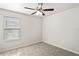 Bedroom showcasing natural light, neutral carpet, and simple finishes at 7350 Lumber Port Dr, Ruskin, FL 33573