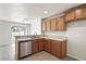 Open kitchen features stainless steel appliances, ample counter space, and seamless flow to dining at 7350 Lumber Port Dr, Ruskin, FL 33573