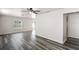 Bright living room with modern gray flooring, neutral walls and natural light from the window at 7350 Lumber Port Dr, Ruskin, FL 33573