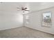 Airy main bedroom with plush carpeting, neutral walls, and natural light from the multiple windows at 7350 Lumber Port Dr, Ruskin, FL 33573
