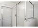 Glass shower stall with tiled walls and a built-in soap holder at 7350 Lumber Port Dr, Ruskin, FL 33573