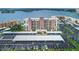 An aerial view of the property with assigned covered parking and a beautiful waterfront view at 7700 Sun Island S Dr # 404, South Pasadena, FL 33707