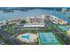 Aerial view of the waterfront community with a pool, tennis courts and plentiful parking at 7700 Sun Island S Dr # 404, South Pasadena, FL 33707