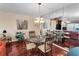 A dining room with a chandelier and mirrored wall, perfect for dinner parties at 7700 Sun Island S Dr # 404, South Pasadena, FL 33707