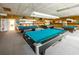 Inviting game room with 4 billiard tables at 7700 Sun Island S Dr # 404, South Pasadena, FL 33707