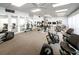 Well-equipped gym with various weight machines, cardio equipment, and mirrored walls at 7700 Sun Island S Dr # 404, South Pasadena, FL 33707