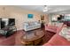 Open living area offering a relaxing space with neutral tones and beautiful flooring at 7700 Sun Island S Dr # 404, South Pasadena, FL 33707