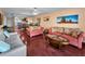 A cozy living room with hardwood floors and natural light, perfect for relaxing or entertaining at 7700 Sun Island S Dr # 404, South Pasadena, FL 33707