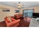 Relax in this comfortable living room with waterfront views, perfect for relaxing or watching TV at 7700 Sun Island S Dr # 404, South Pasadena, FL 33707