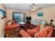 Spacious living room with water views, and lots of seating for friends and Gathering at 7700 Sun Island S Dr # 404, South Pasadena, FL 33707