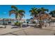 Scenic outdoor grilling area with tiki hut seating overlooking the waterfront and boat docks at 7700 Sun Island S Dr # 404, South Pasadena, FL 33707