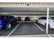 Assigned covered parking area with multiple cars parked under the structure labeled as 404 at 7700 Sun Island S Dr # 404, South Pasadena, FL 33707