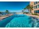 Beautiful community waterfront pool on a sunny day at 7700 Sun Island S Dr # 404, South Pasadena, FL 33707