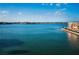 Expansive waterfront view showcasing the serene, calm water and distant residential areas at 7700 Sun Island S Dr # 404, South Pasadena, FL 33707
