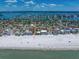 An aerial view showcases the property's proximity to the beach with neighborhood and waterfront views at 785 Bay Esplanade, Clearwater Beach, FL 33767