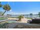 Waterfront backyard featuring pool, hot tub, and lush landscaping at 785 Bay Esplanade, Clearwater Beach, FL 33767