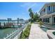 Serene backyard oasis with a private dock, patio, and stunning waterfront views, perfect for relaxation at 785 Bay Esplanade, Clearwater Beach, FL 33767
