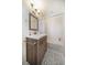 Bathroom with a modern vanity, and shower with white tiles at 785 Bay Esplanade, Clearwater Beach, FL 33767