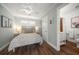 Charming bedroom featuring a ceiling fan and an ensuite bathroom with white shiplap at 785 Bay Esplanade, Clearwater Beach, FL 33767